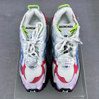 Balenciaga unisex sneakers front view, white uppers with blue and red overlays, neon green laces