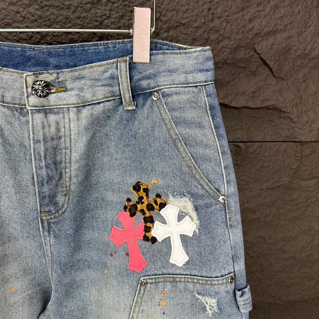 Light blue denim shorts detail with floral cross patch on thigh