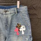 Light blue denim shorts detail with floral cross patch on thigh