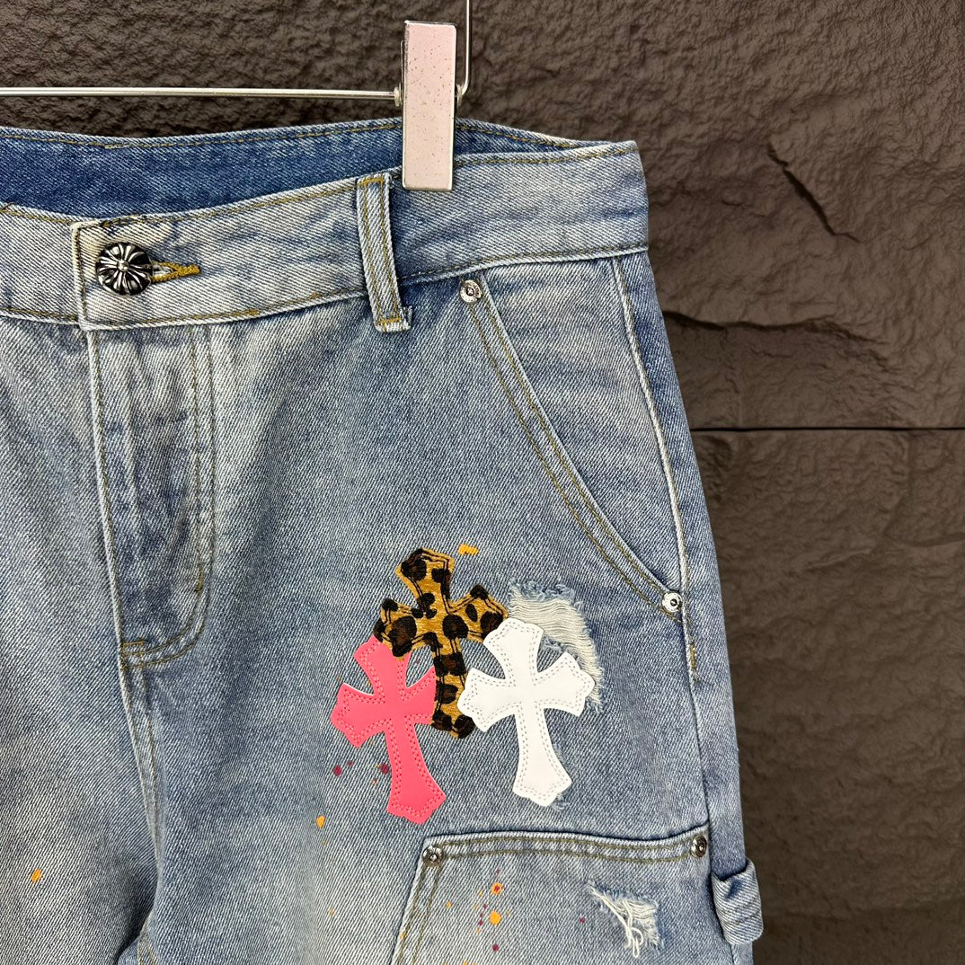 Light blue denim shorts detail with floral cross patch on thigh