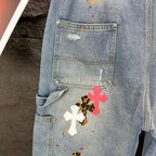 Denim shorts pocket detail with colorful cross graphic on thigh