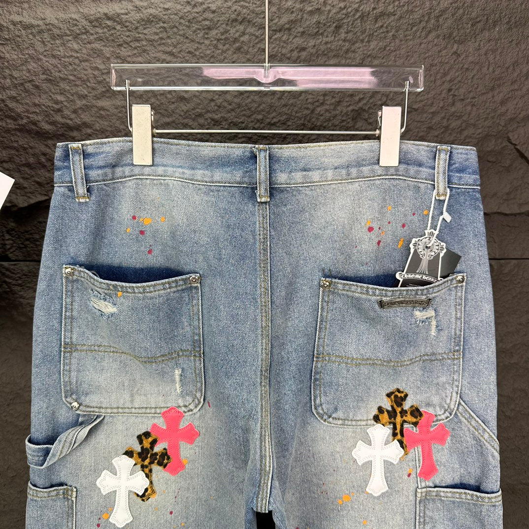 Light blue denim shorts rear view with two patch pockets and cross graphics
