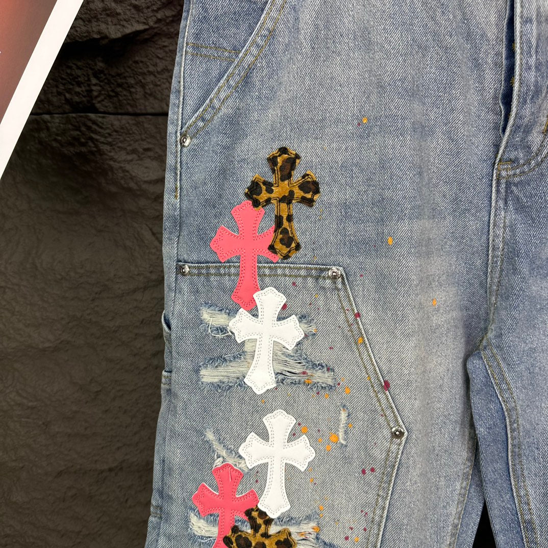 Light blue denim shorts close-up of cross patches on front pocket area