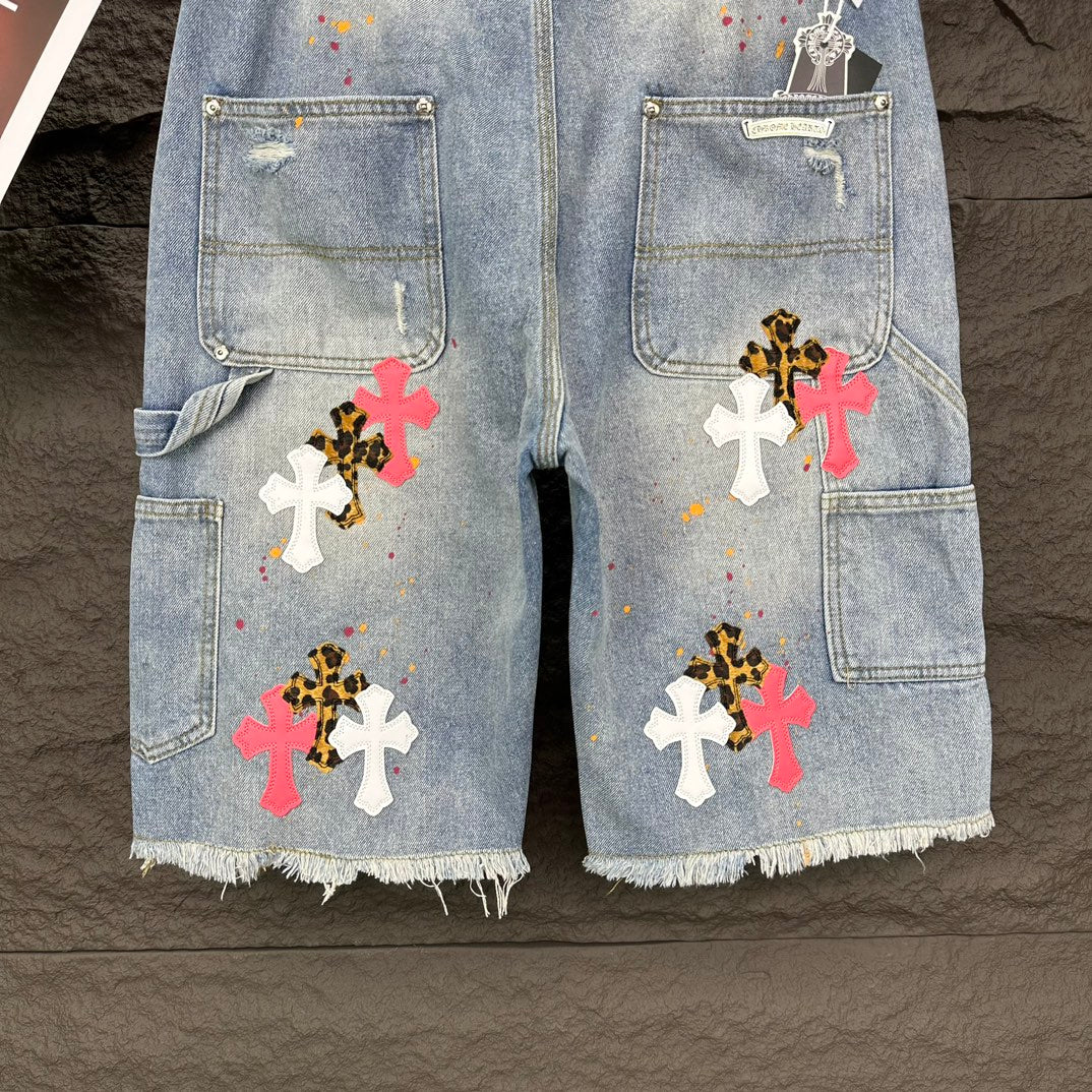 Light blue denim shorts front view with cross appliqués and cargo-style pockets