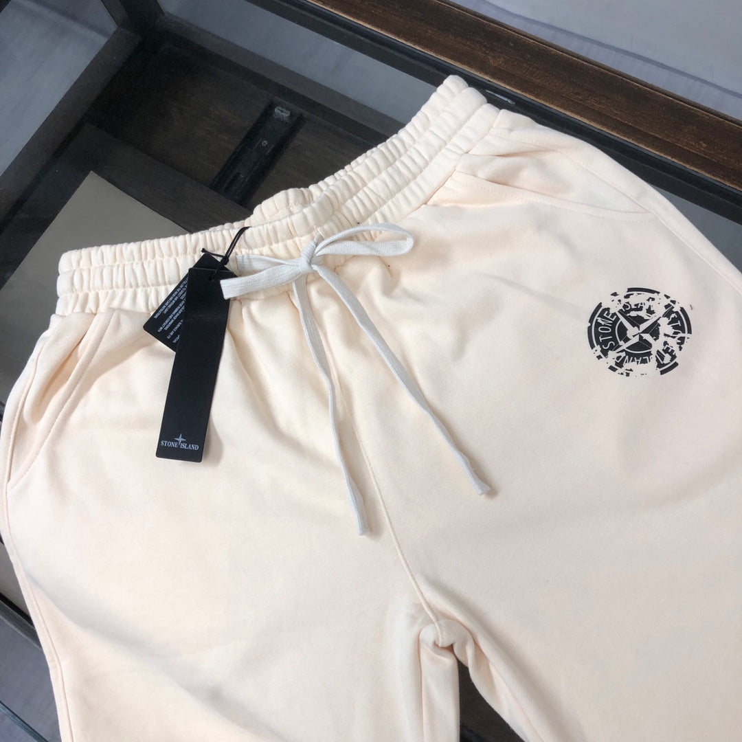 Stone Island cream shorts with drawstring and small logo on the front