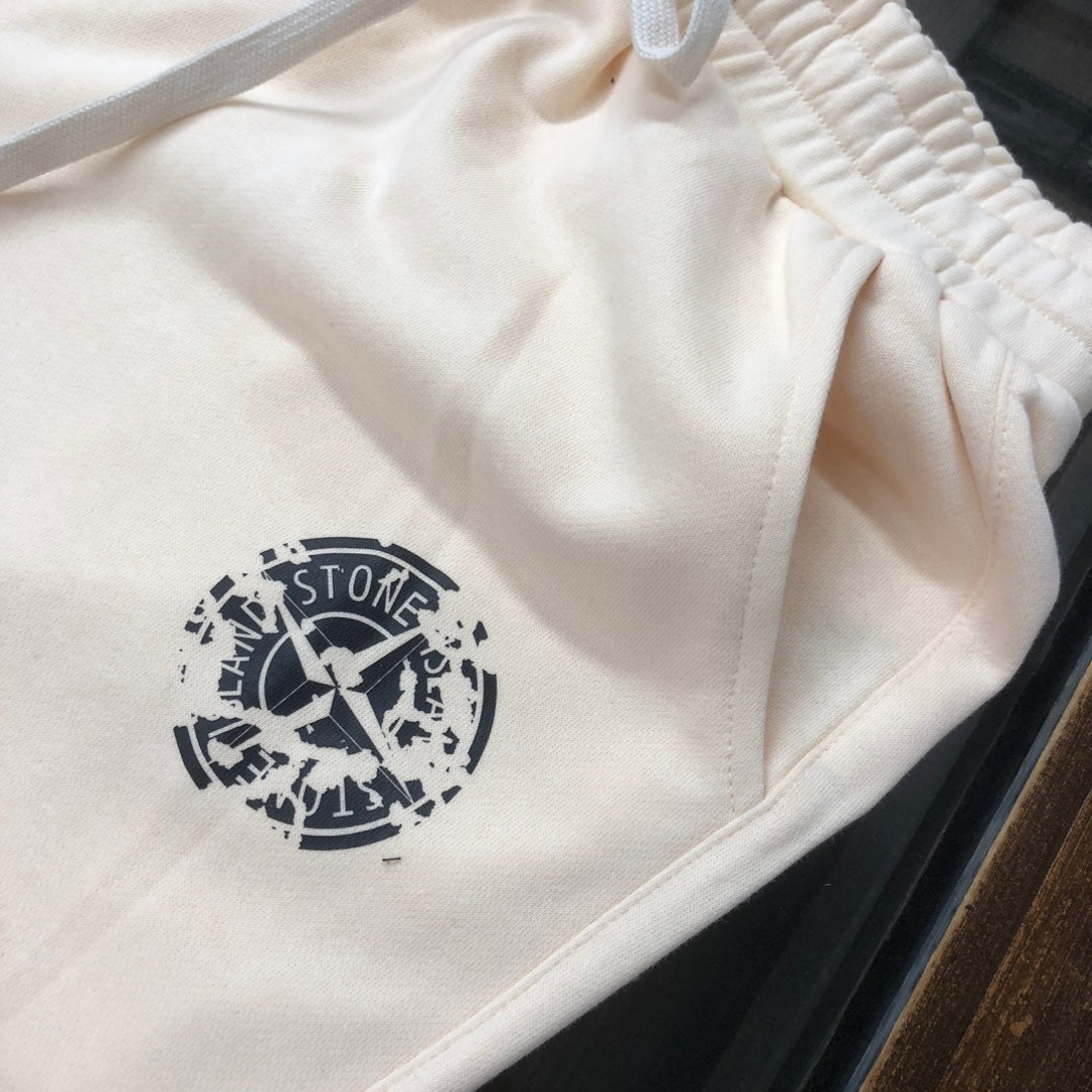 Stone Island cream shorts with logo print on the thigh and elastic waistband