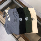 Stone Island shorts in blue, black, green, and cream; elastic waist and drawcord