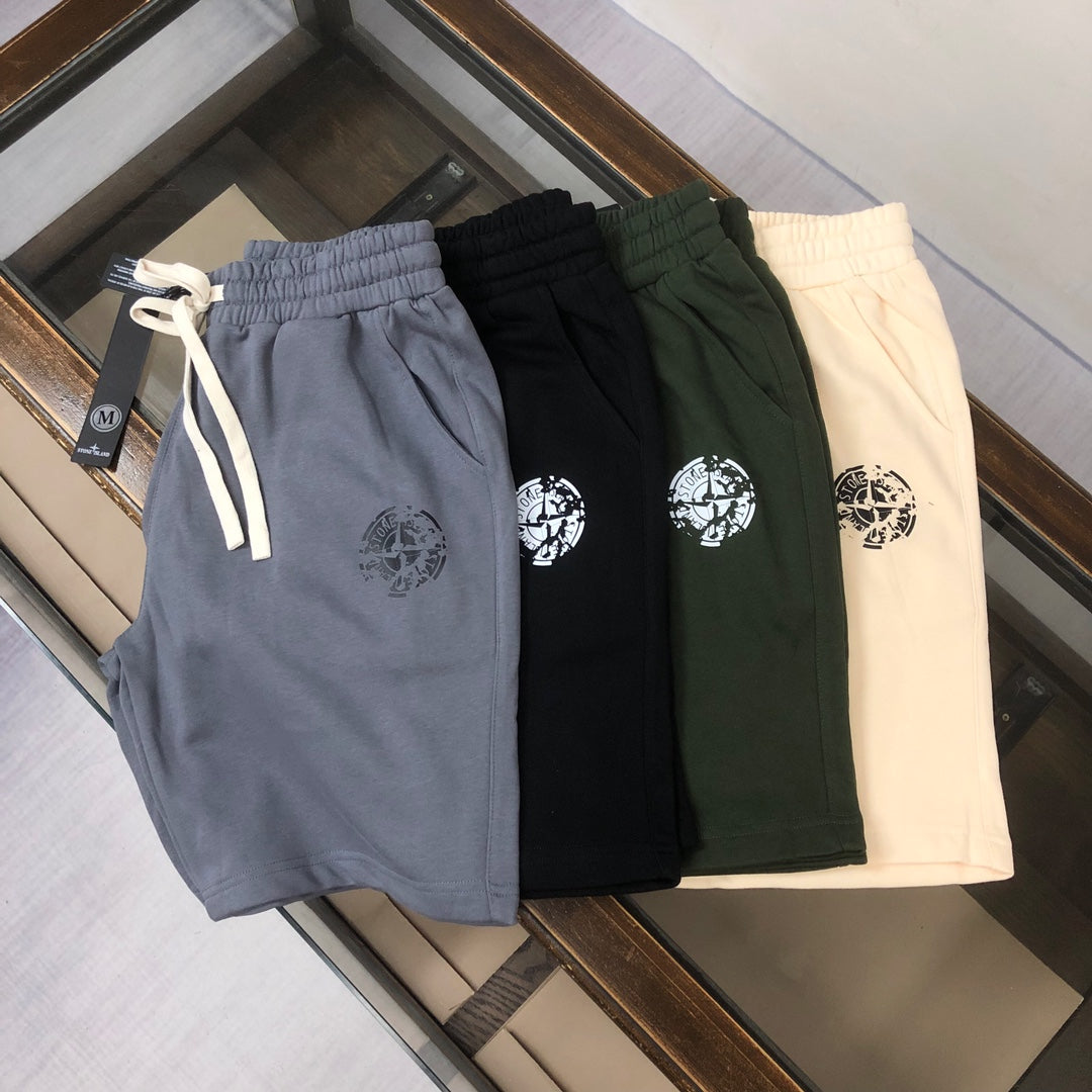 Stone Island shorts in blue, black, green, and cream; elastic waist and drawcord