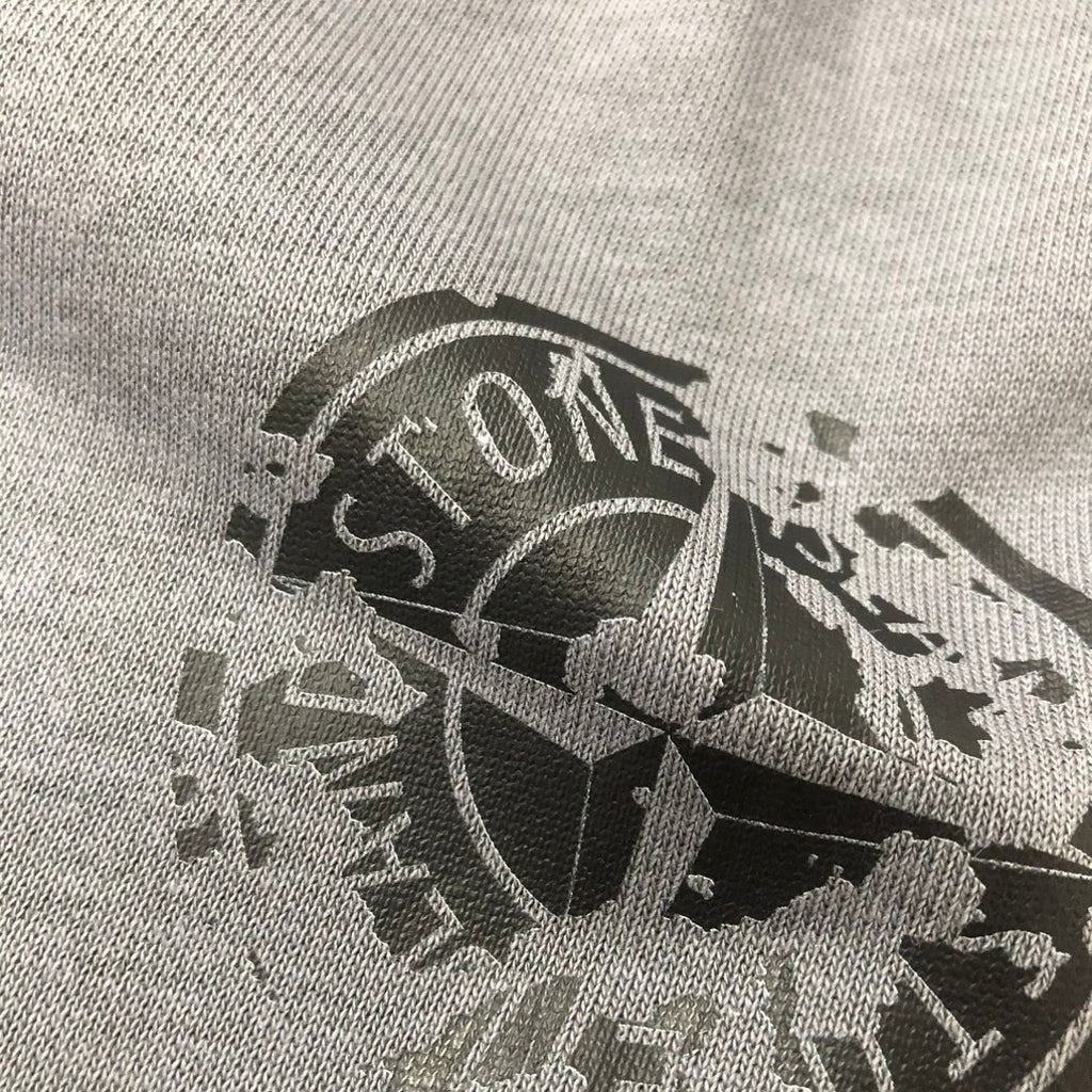 Large logo print on light gray knit fabric