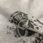 Large logo print on light gray knit fabric