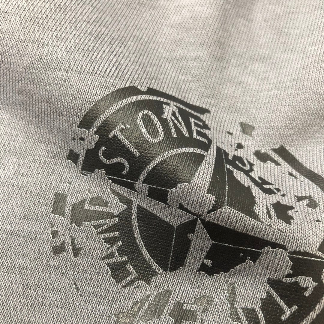 Large logo print on light gray knit fabric