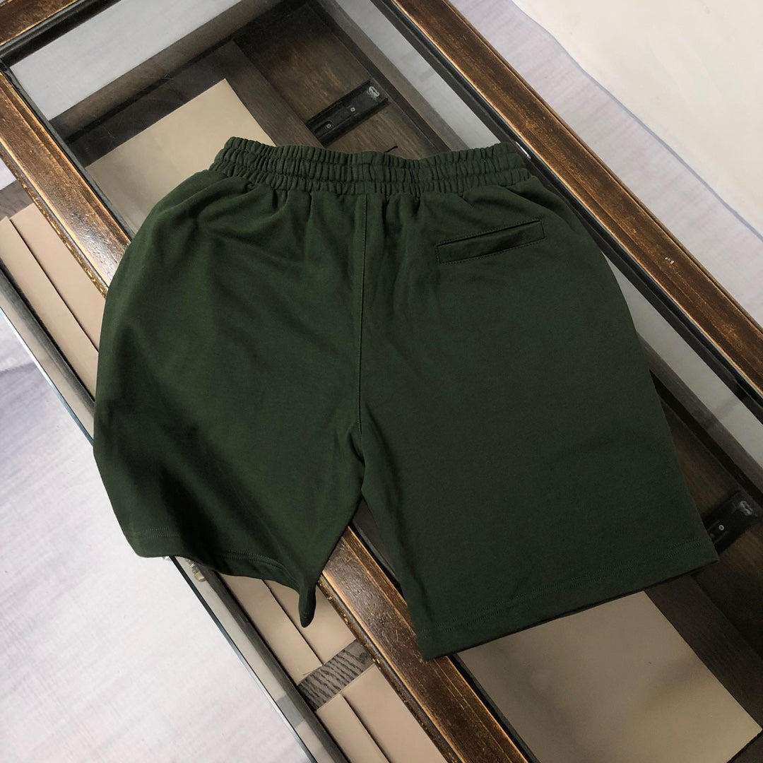 Stone Island dark green shorts with elastic waistband, smooth back view