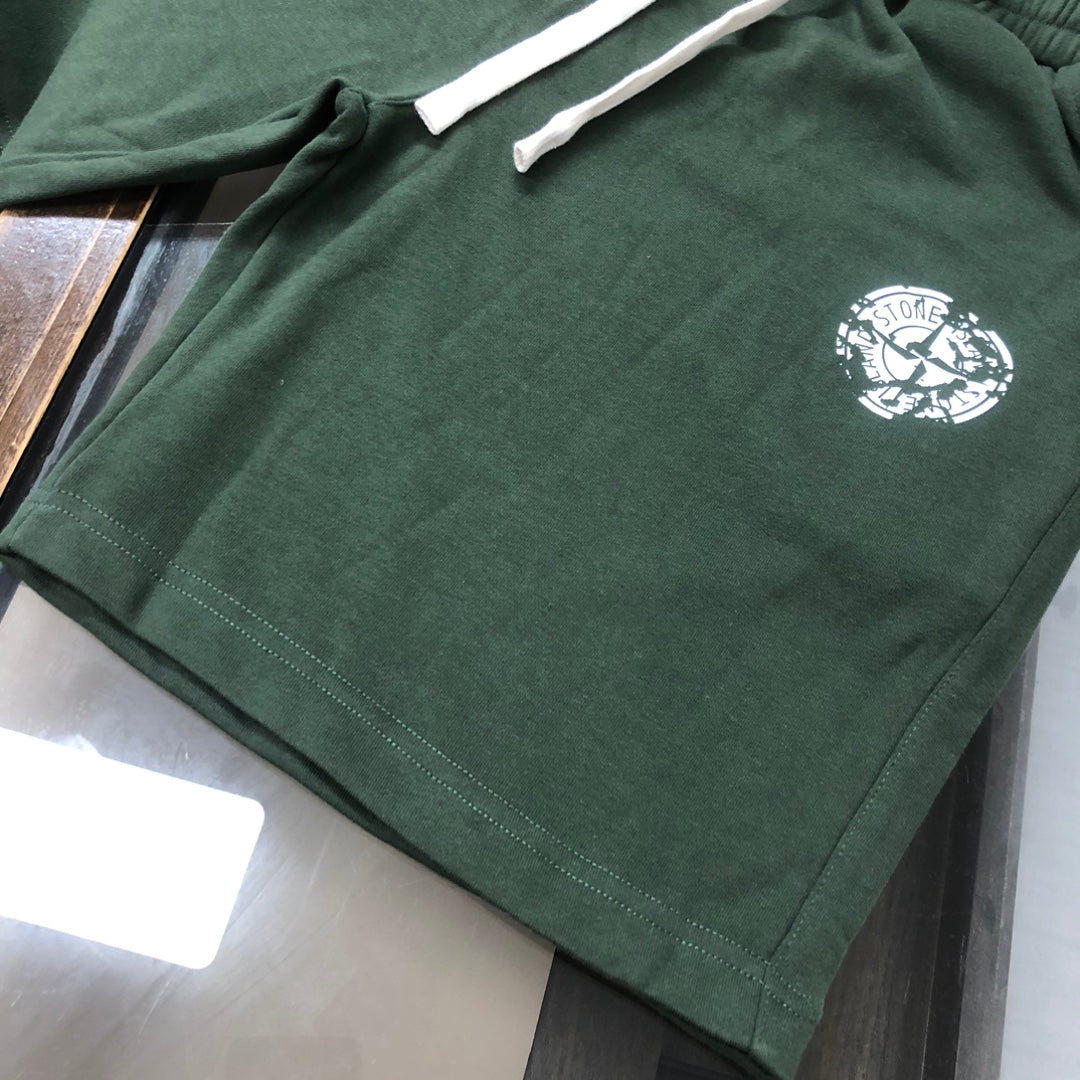 Stone Island dark green shorts with drawstring cord and white logo emblem