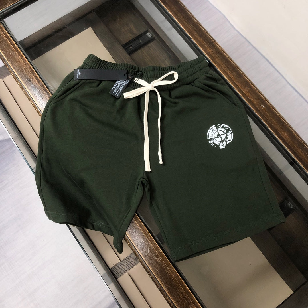 Stone Island green drawstring shorts with elastic waistband and logo patch
