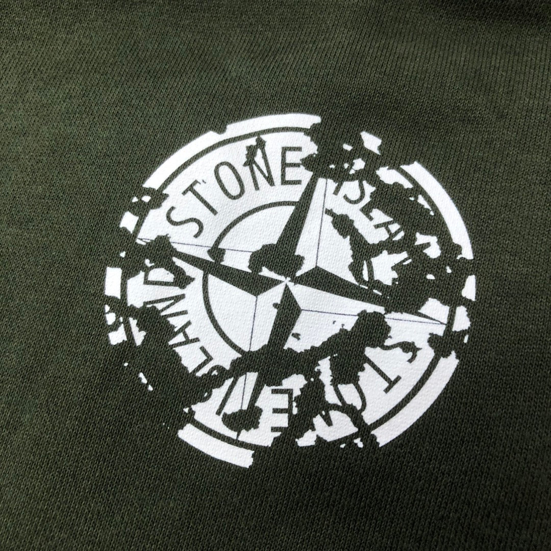Stone Island logo print on dark green shorts fabric