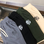 Drawstring shorts set, black and dark green with printed logo