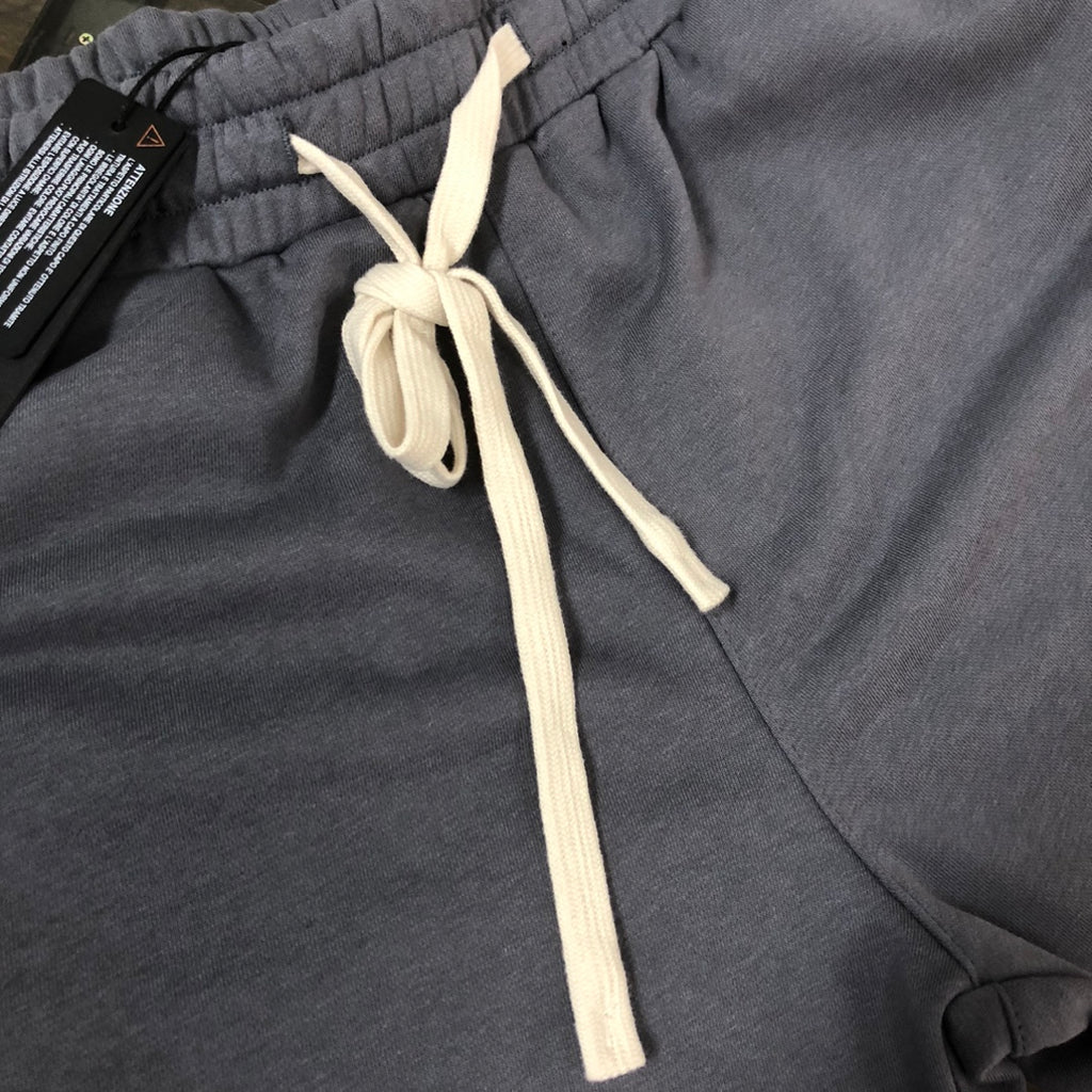 Stone Island dark gray shorts with elastic waistband and long white drawstring ties