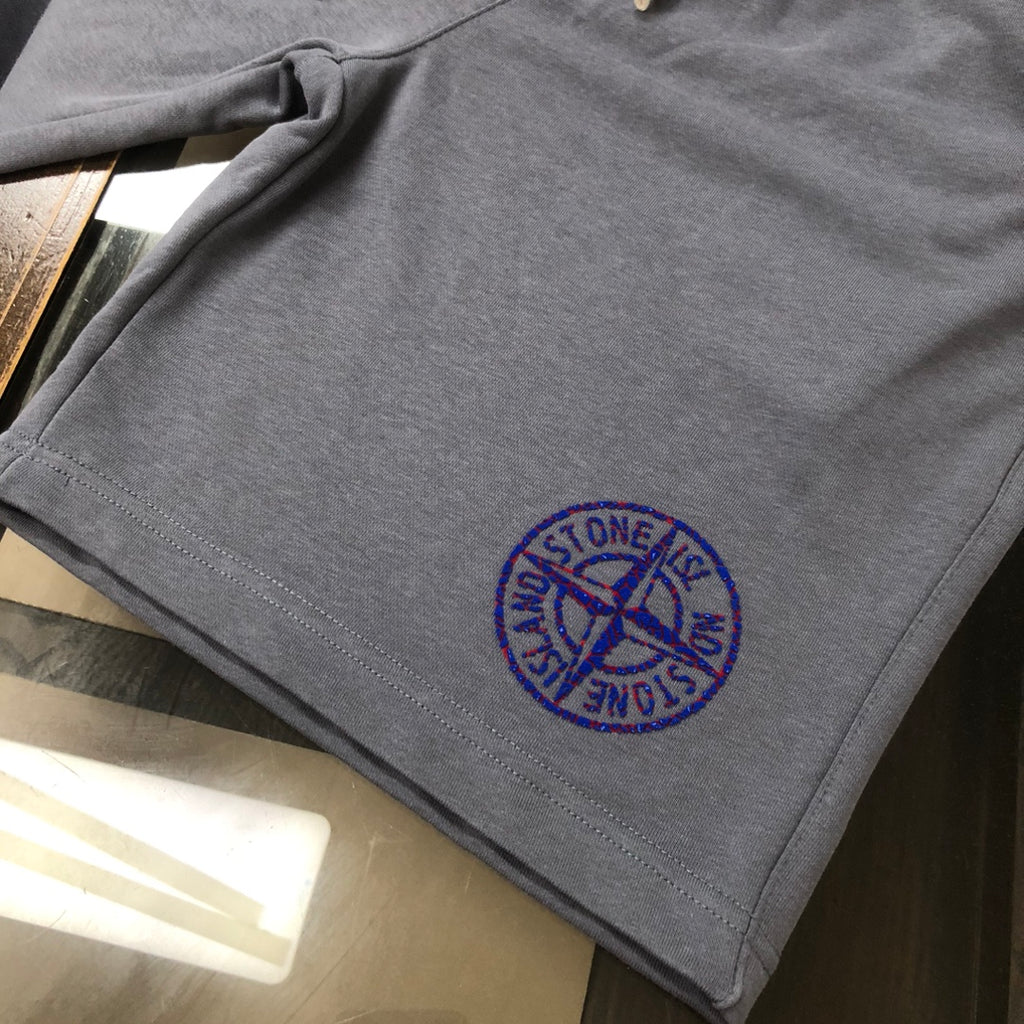 Stone Island dark gray shorts with blue embroidered logo on the leg