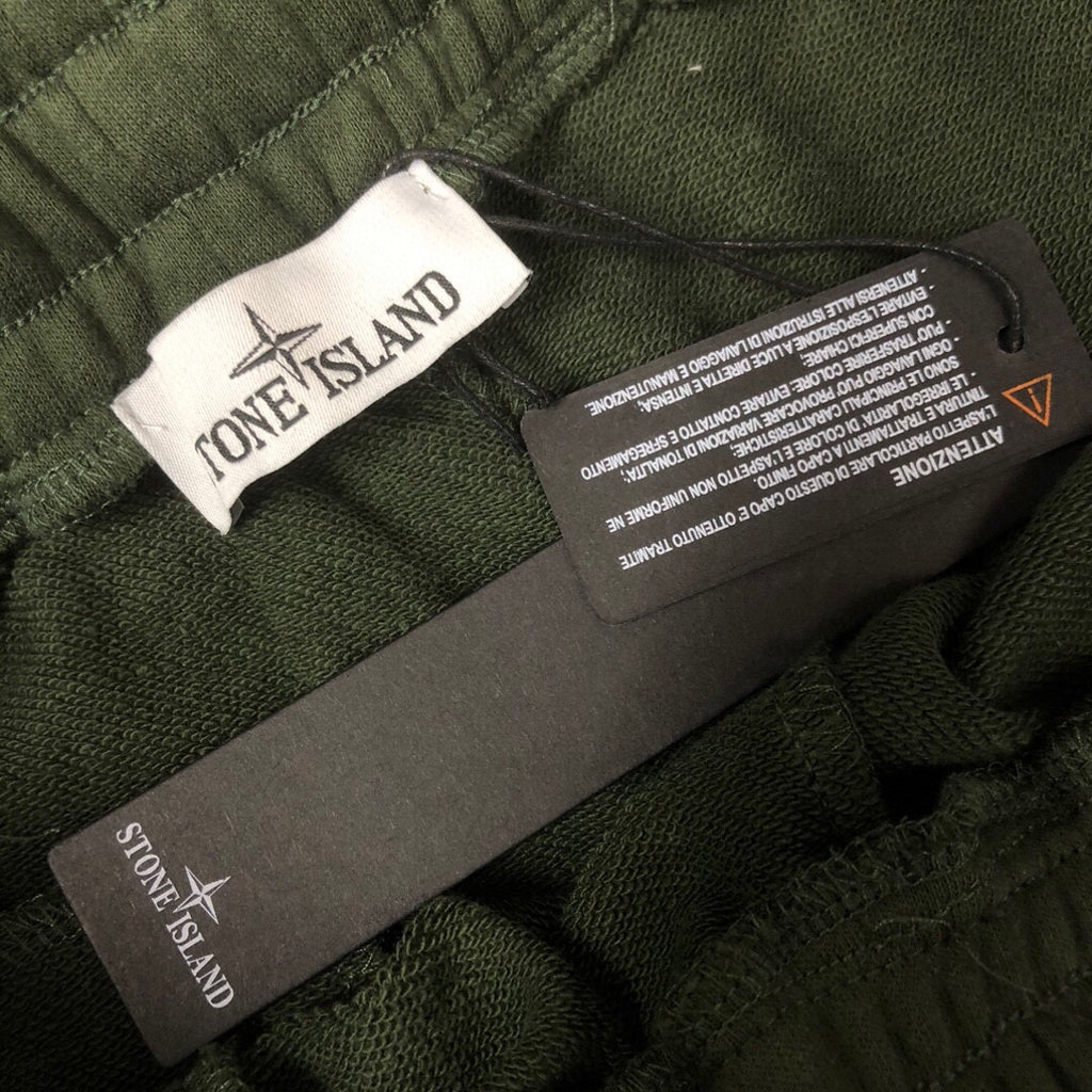 Stone Island inner labels on dark green drawstring shorts