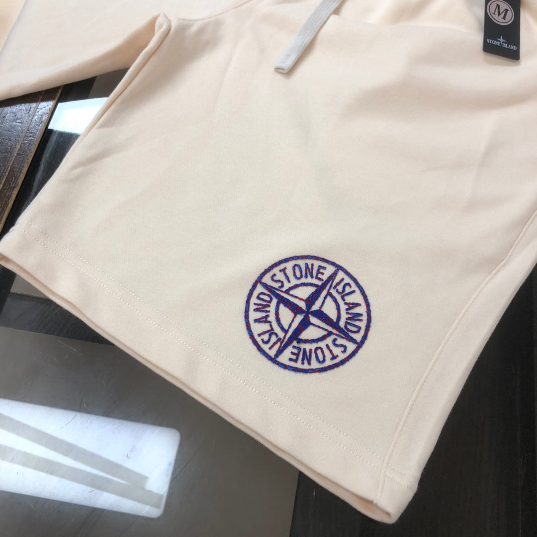 Stone Island logo shorts with drawstring, light cream and blue patch on front