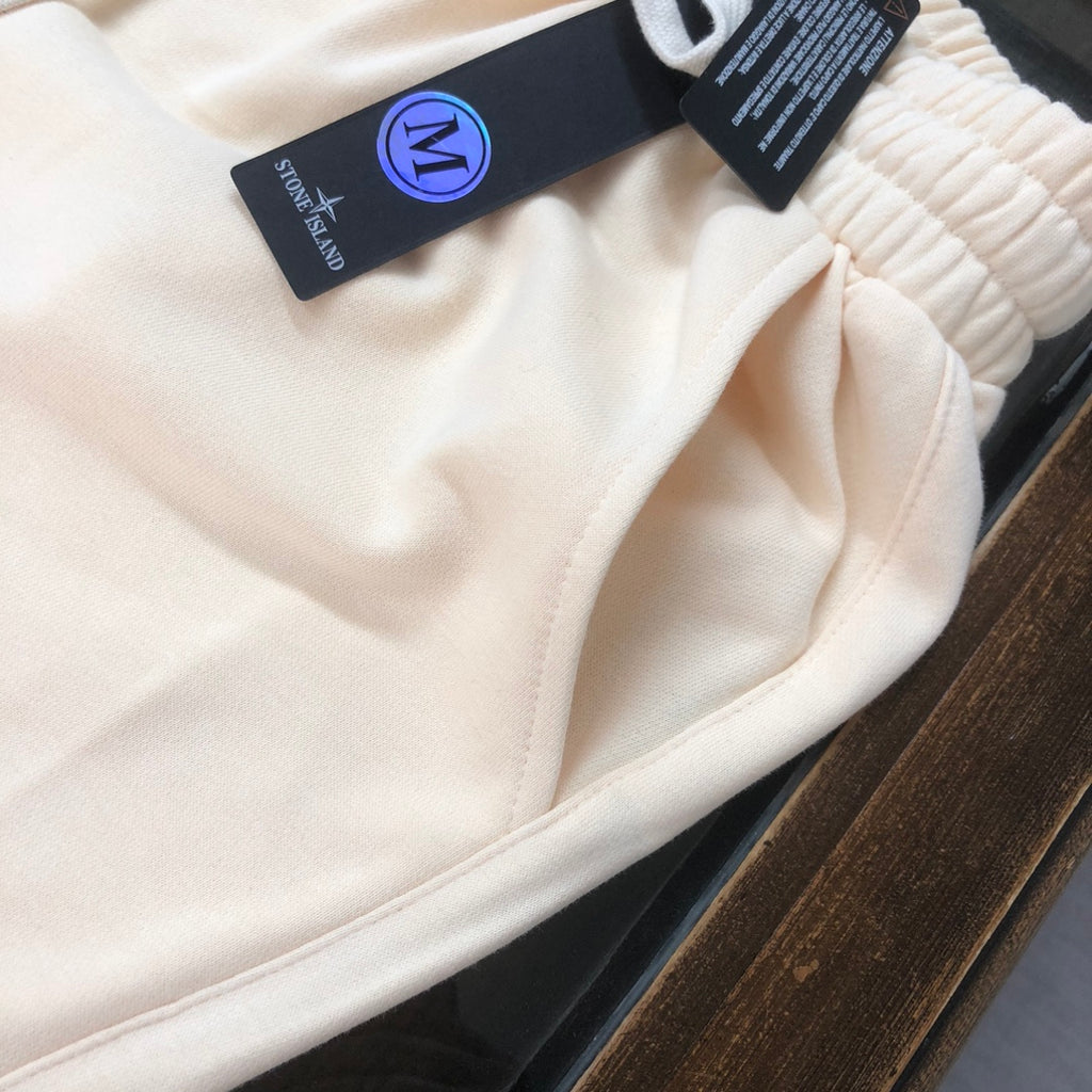 Stone Island drawstring shorts waistband and seam detail, light cream