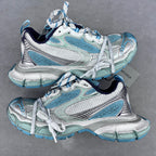 Balenciaga unisex running shoes in light blue and white with lace-up front.