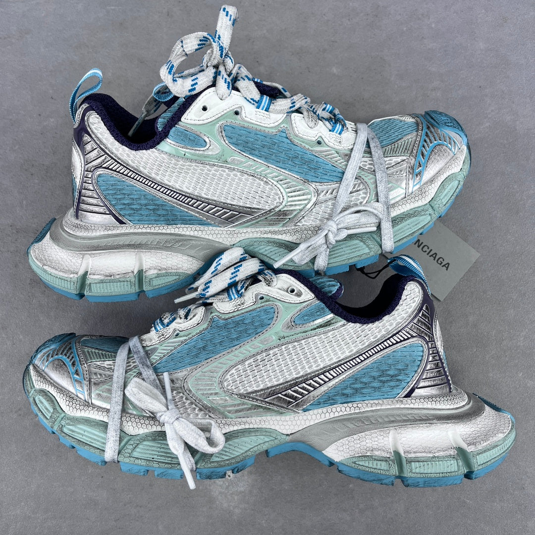Balenciaga unisex running shoes in light blue and white with lace-up front.