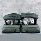 Balenciaga dark green sandals, heel view with BALENCIAGA logo and textured sole