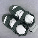Balenciaga dark green sandals with ankle strap, lace detail, and cushioned footbed