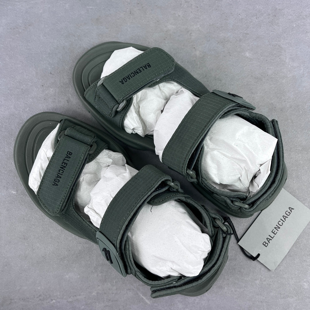 Balenciaga dark green sandals with ankle strap, lace detail, and cushioned footbed