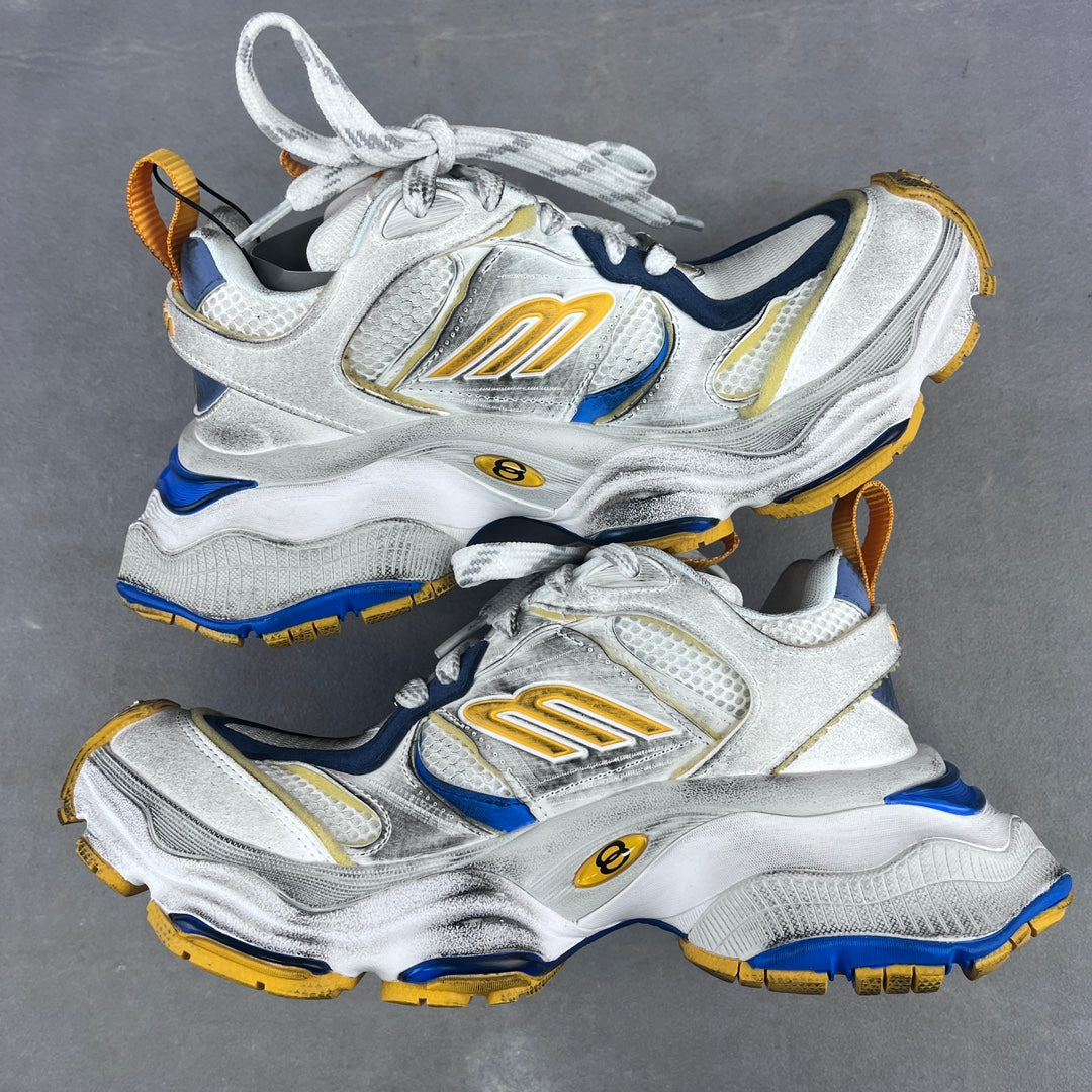 Balenciaga unisex sneakers pair in silver with blue side stripes and gold logo on the uppers.