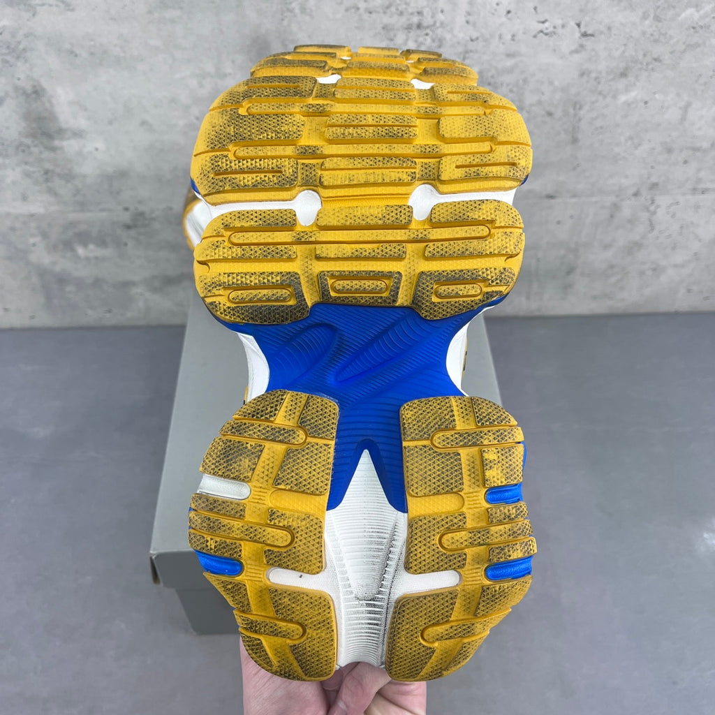 Balenciaga unisex sneaker outsole view with yellow tread and blue midfoot section.