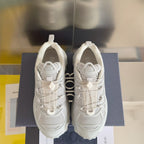 Dior unisex white sneakers, front view pair with lace-up and textured upper