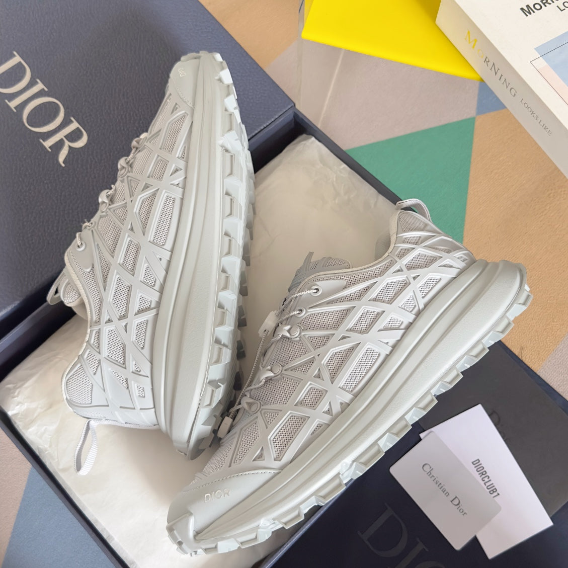 Dior unisex white sneakers, side view with lace-up front and chunky sole