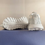 Dior unisex sneakers, white, outsole view with tread pattern and heel logo patch