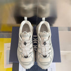 Dior unisex sneakers, white, front view with lace-up mesh and cushioned collar