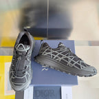 Dior unisex sneakers, side view of dark gray uppers with white lattice straps