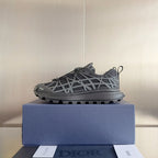 Dior unisex sneakers on blue box, dark gray lace-up with white lattice front