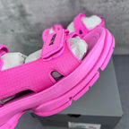 Pink Balenciaga sandal with textured upper, hook-and-loop strap, and chunky sole