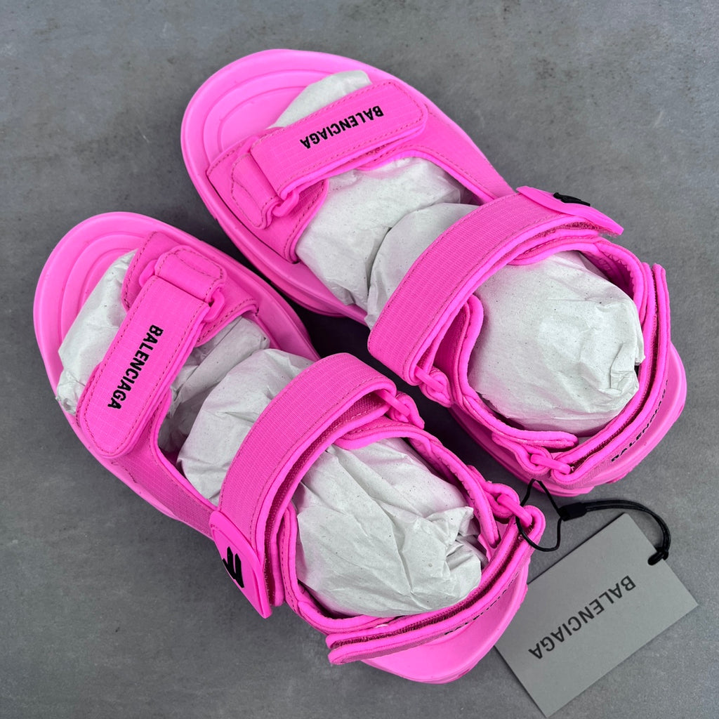 Pink Balenciaga sandals with wide straps and printed BALENCIAGA heel branding
