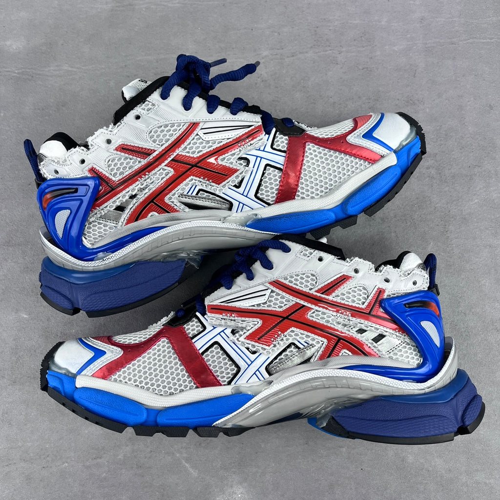 Front view of white, red and blue unisex chunky sneakers with blue laces and mesh uppers.