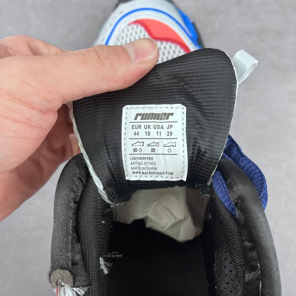 Size and brand label inside chunky sneakers; tag shows EUR/UK/US/JP 44 and 10 11 29.