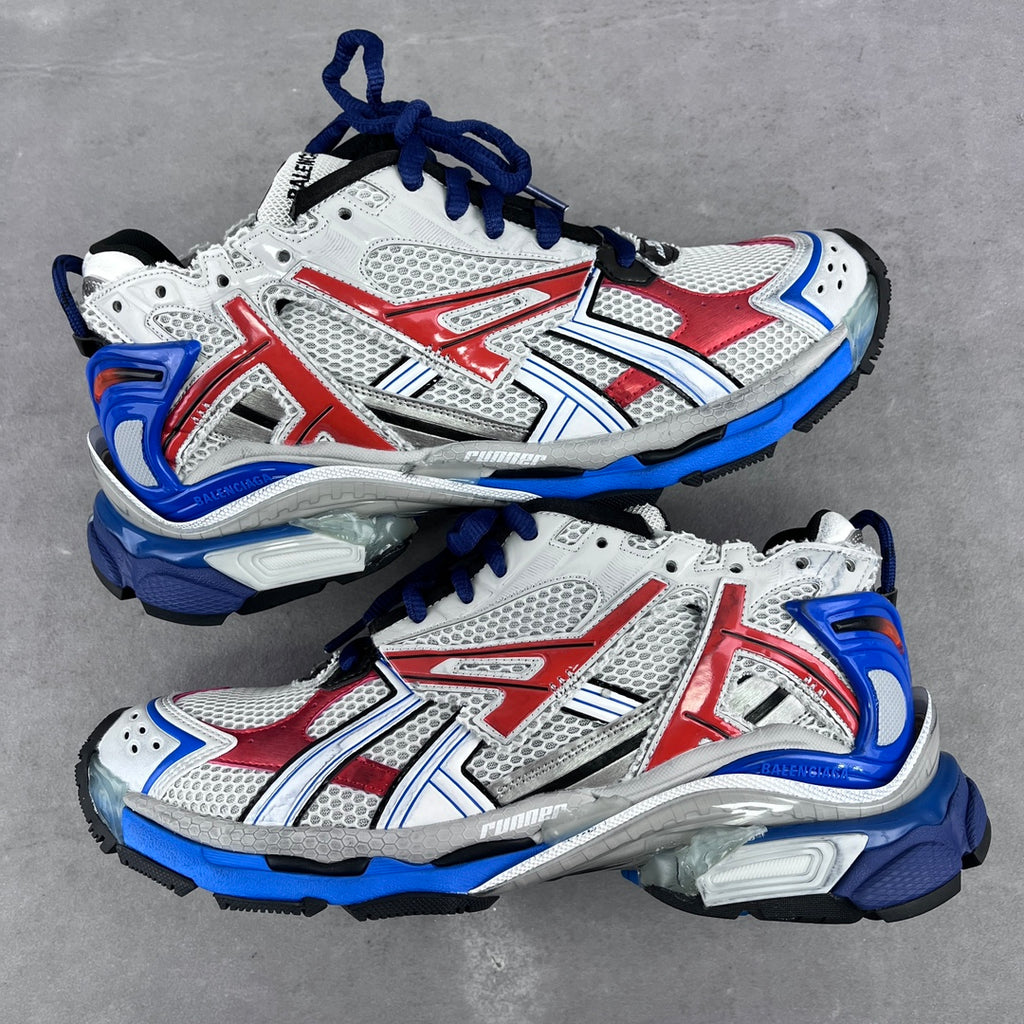 White, red and blue unisex chunky sneakers with mesh panels and lace-up front.