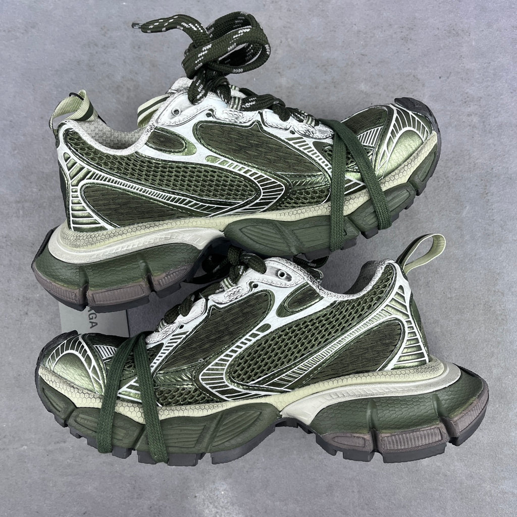 Front view pair of chunky sneakers with green laces, white and silver mesh panels