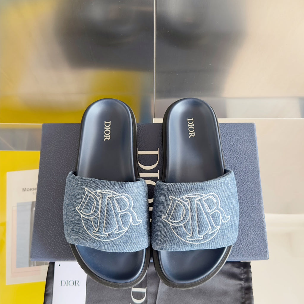 Dior slide sandals with dark denim straps and white monogram, navy footbeds