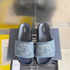 Dior slide sandals with dark denim straps and white monogram, navy footbeds