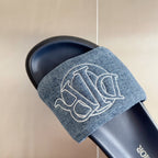 Dior slide sandal with denim strap and white Dior monogram, navy footbed