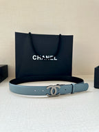 Light blue leather belt featuring a Chanel CC buckle on the front strap