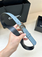 Light blue leather belt with Chanel CC buckle and metal prong detail