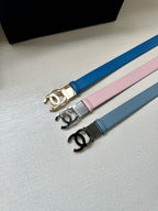 Belts with CC buckles in blue, pink, and gray with metal emblems